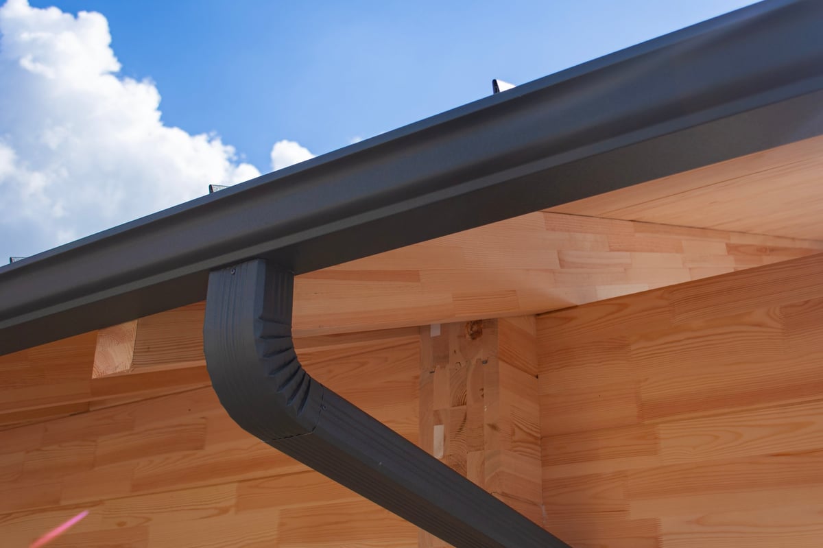 Close-up of contemporary dark gray rain gutter