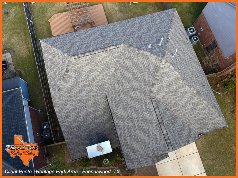 Aerial view of a residential home roof with gray shingles in Heritage Park Area, Friendswood, TX